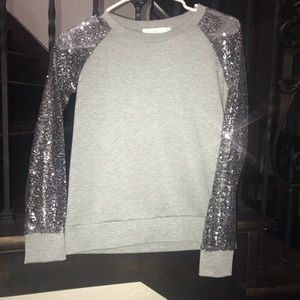 grey sweater with sparkle sleeves